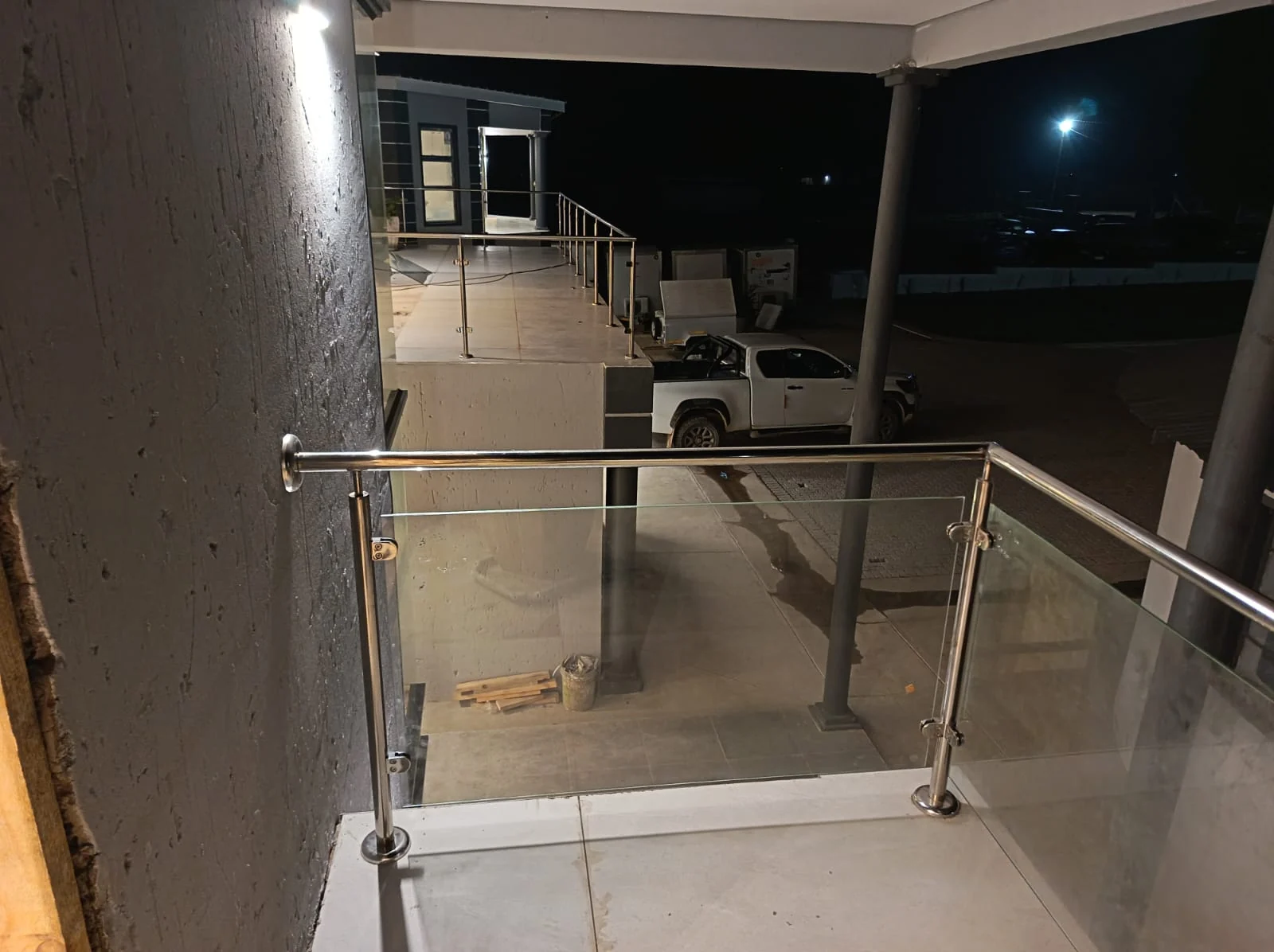 Glass balustrade installation photographed at night