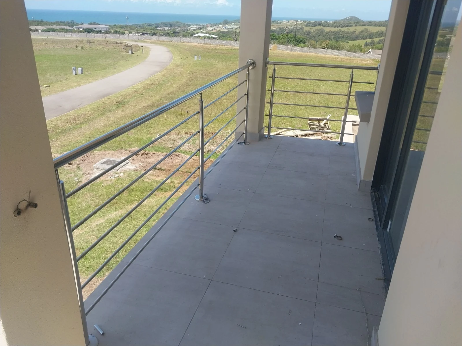 Stainless steel balcony overlooking the property